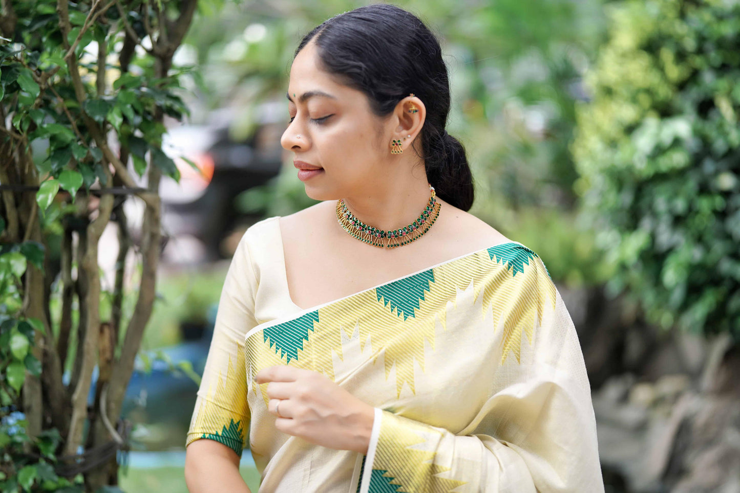 Temple golden tissue saree bottle green